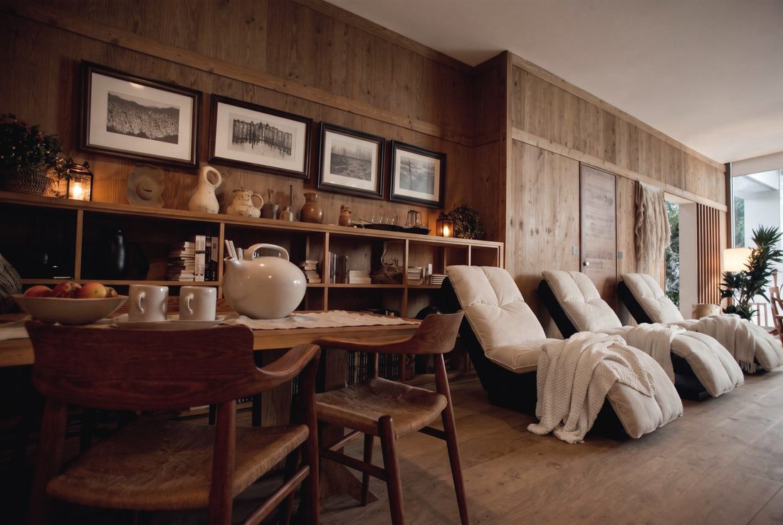 The rest room: reclined chairs under cream linen, the long tea table at the far end.